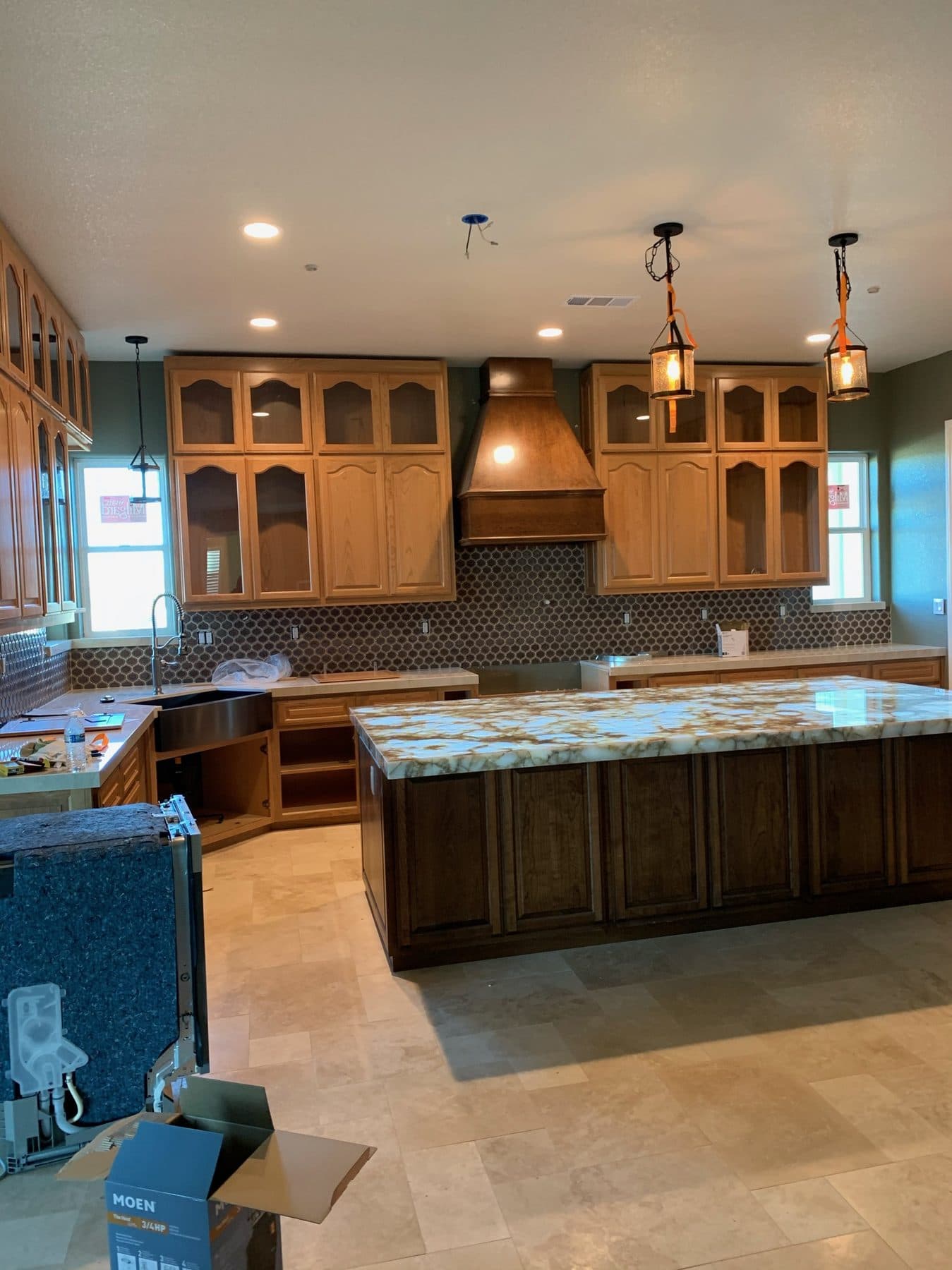 Oak kitchen with range hood and island