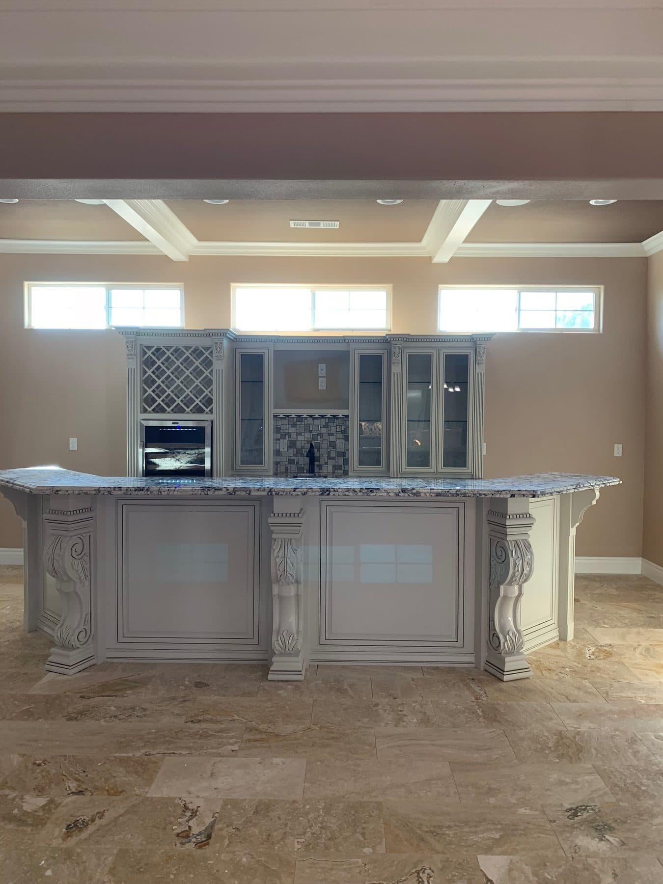 Island with corbels and wet bar wall