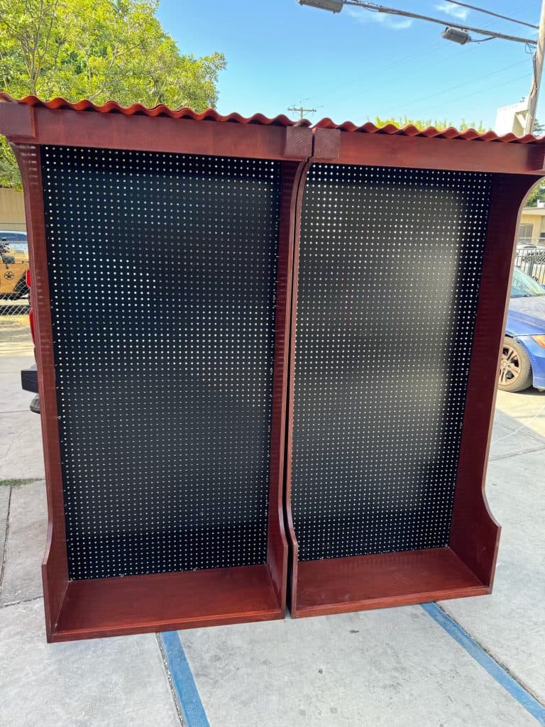 Stained pegboard display with tile-roof cap